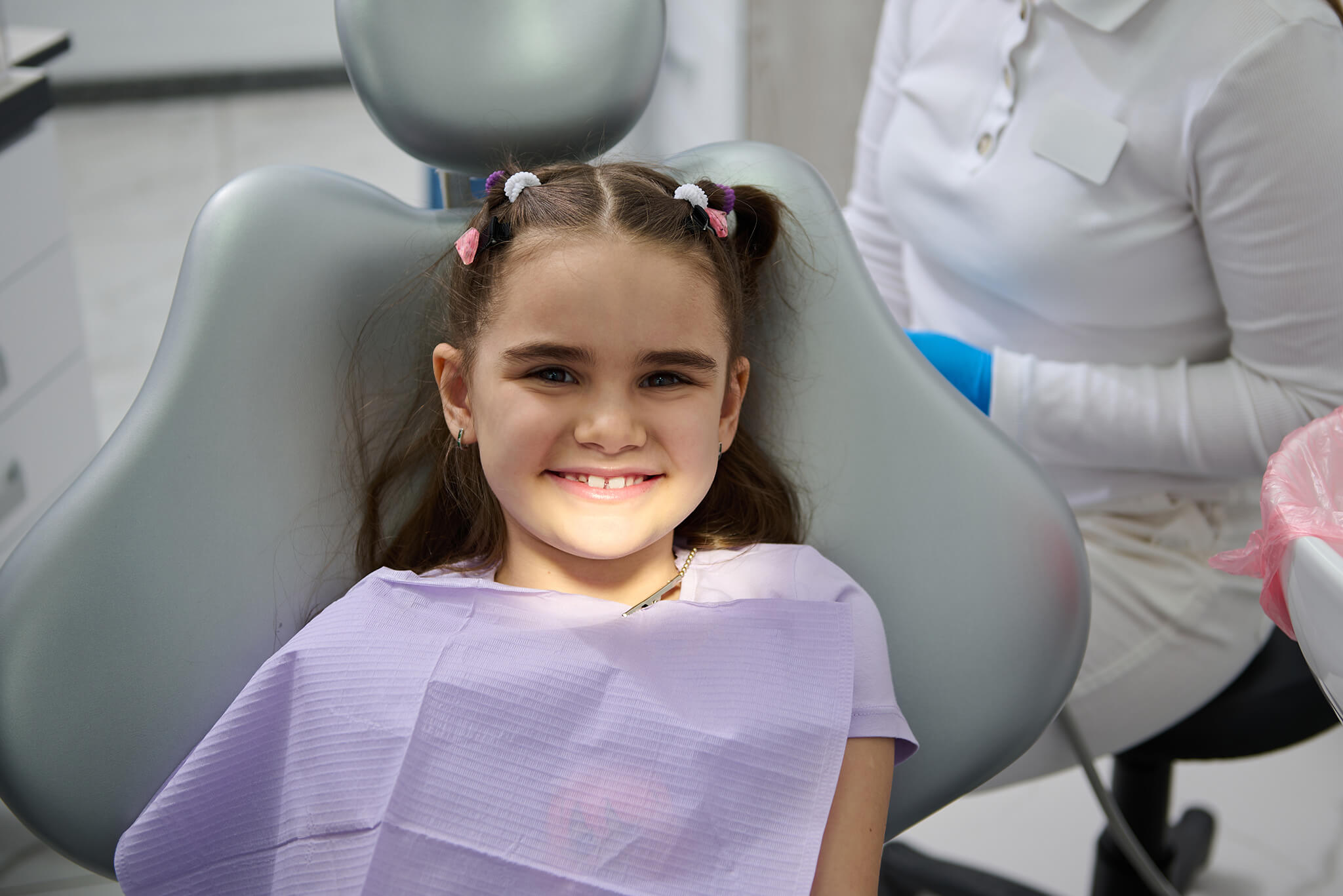 Patient getting aesthetic pediatric crown – color matching children’s dental crowns